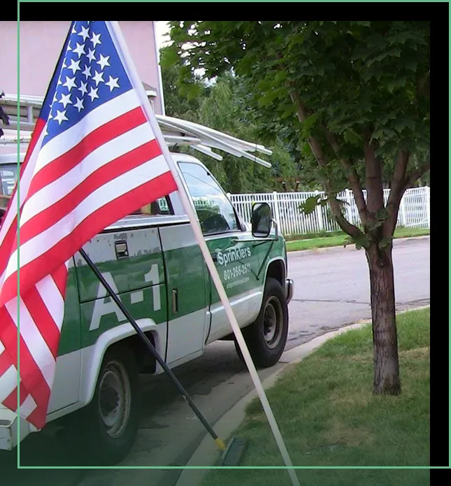 A1 Sprinklers service truck with an American flag